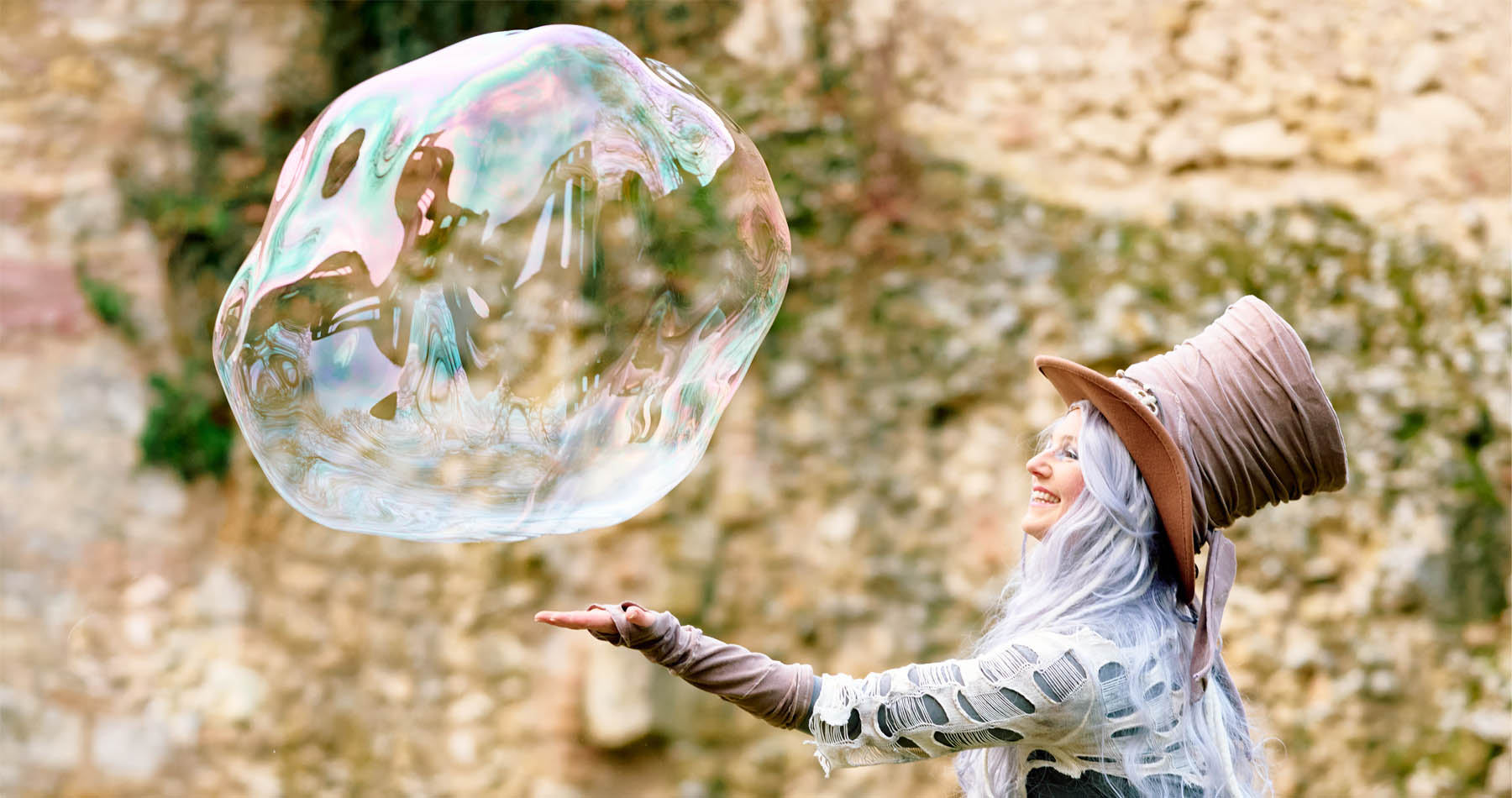 Giant soap bubble with artist